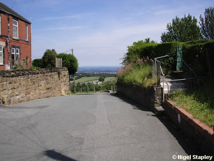 Picture of a road at the top of a hill
