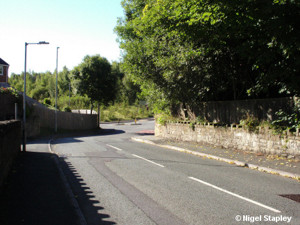 Photo of a road with a pub on the left-hand side