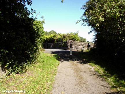 Looking up a track towards a sharp bend in the road