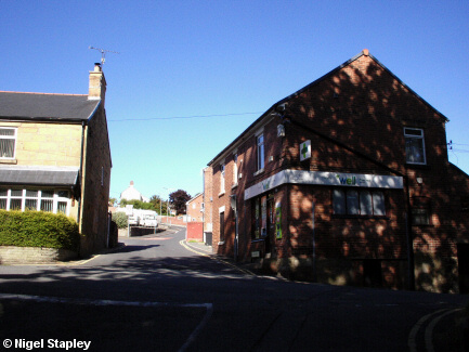Photo of a crossroads with a pharmacy on it