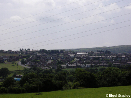 Picture of a village seen from across a valley