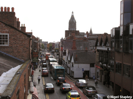 Picture of a busy city street, viewed from a bridge over it