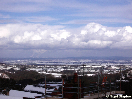 Picture across a plain on a snowy day