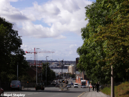 Picture of a city road leading down to a river