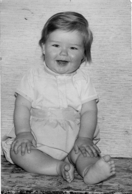 Picture of baby sitting up and smiling