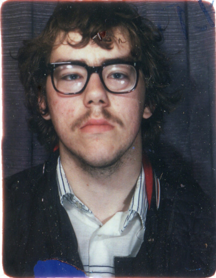 Passport-style photo of a young man