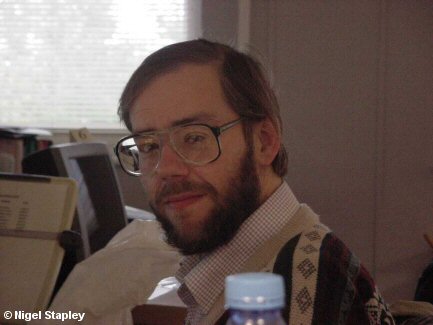 Picture of a man sitting at a desk