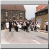 Picture of a marching band on a village street