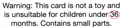 Scan of a card inside a birthday card for a one-year-old: 'This card [...] is unsuitable for children under 36 months'
