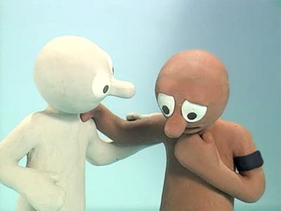 Picture of Morph (with black armband) being consoled by Chaz