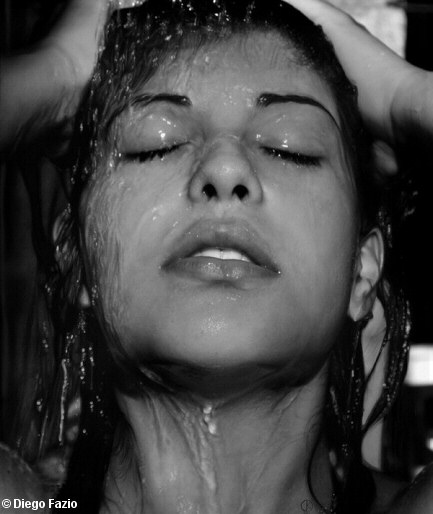 Pencil illustration of a young woman's head which looks like a black and white photograph