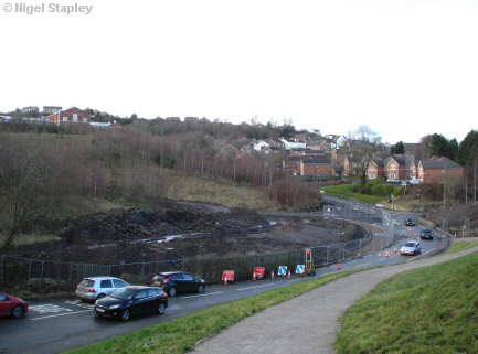 Photo of a stretch of road with temporary traffic lights