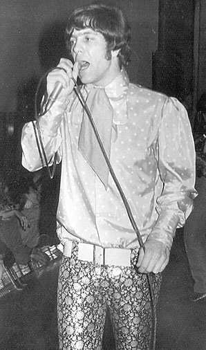 Photo of Dave Dee on stage in the 60s
