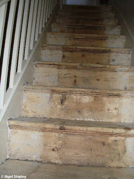 Photo looking up some sanded stairs