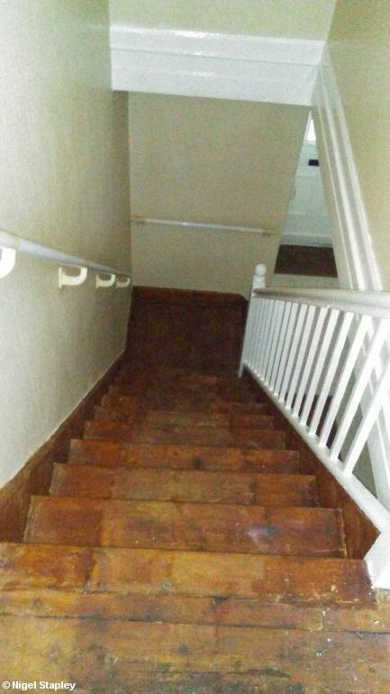 Photo of woodstained skirting boards on a staircase