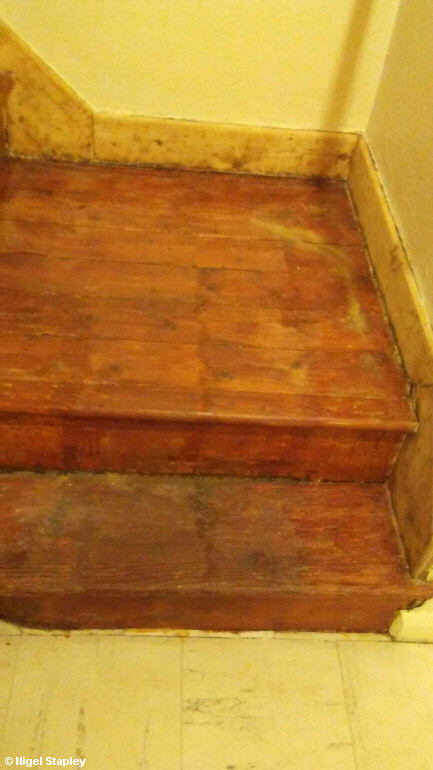 Photo of sanded skirting boards on a staircase