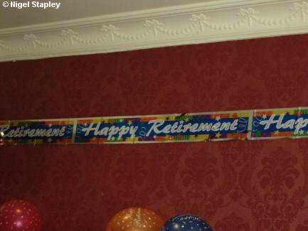 Picture of a'Happy Retirement' banner on a wall